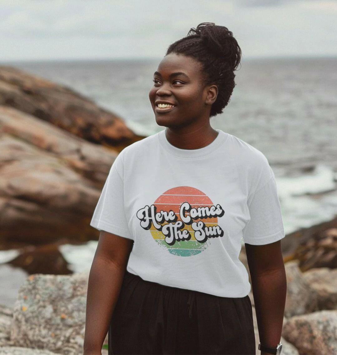 Sun shining brightly over a women's organic cotton t-shirt, highlighting sustainable fashion and eco-friendly apparel