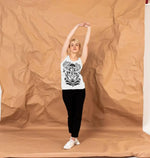 Bee collecting nectar from vibrant flowers while wearing a protective bee vest top, promoting beekeeping and nature.